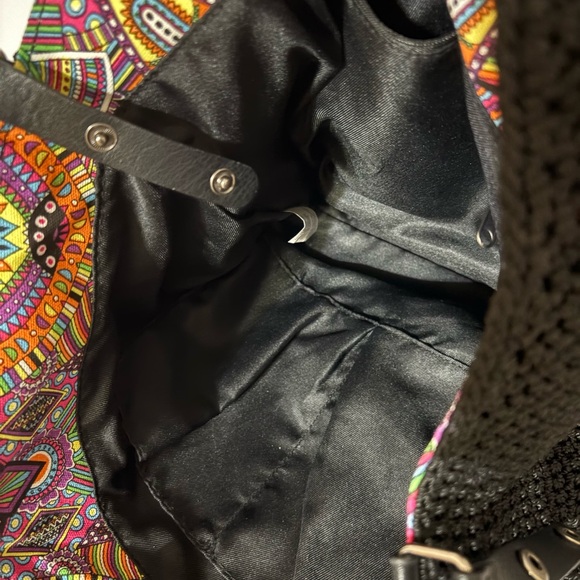 Sakroots bag, characterized by its distinctive bohemian and colorful design. - Picture 10 of 12